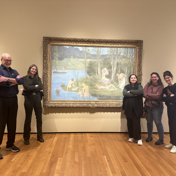 A picture of Dr. Klein and students Claire Lyman, Ela Sutcu, Madi Hester, and June Scalia standing on either side of a painting by Puvis de Chavannes