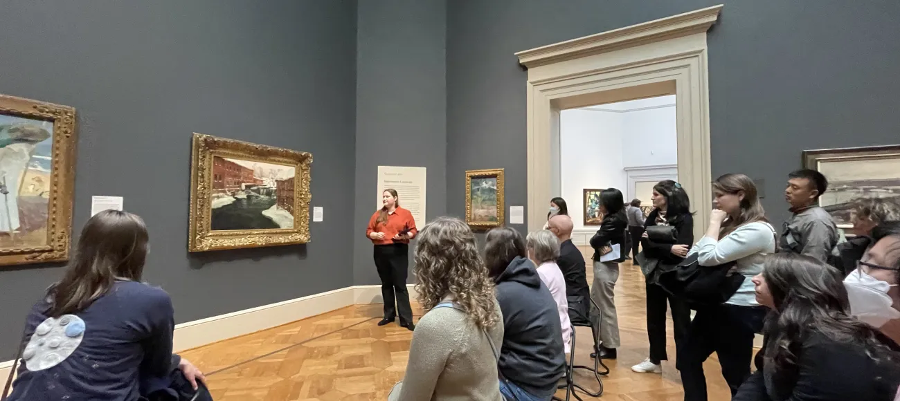 An image of Elizabeth Mangone standing in front of the audience for the pop-up talks