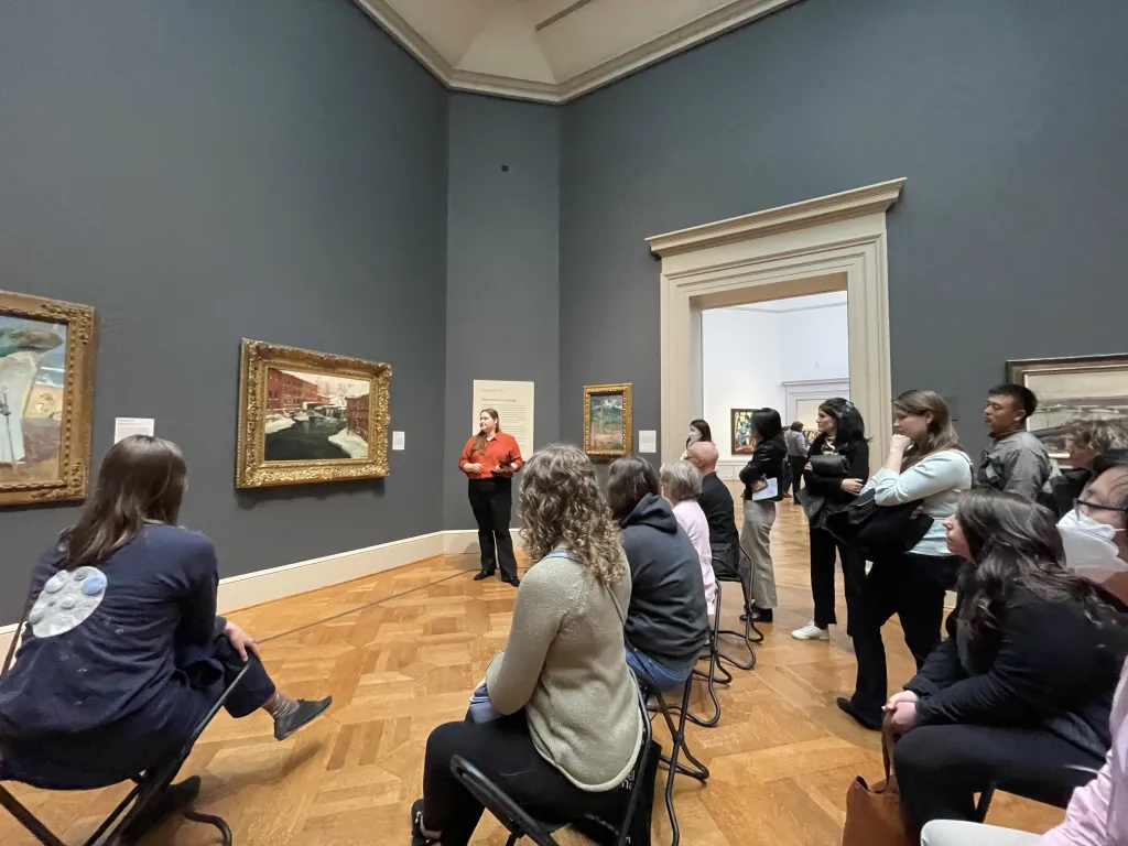 An image of Elizabeth Mangone standing in front of the audience for the pop-up talks